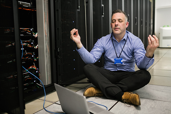 stock network photos network technician meditating in data center